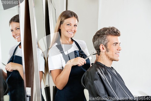 Image of Hairdresser Cutting Client's Hair