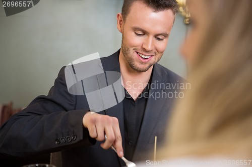 Image of Businessman Having Meal With Female Colleague