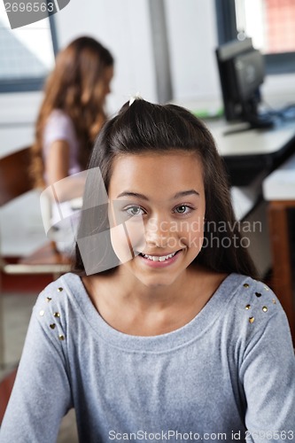 Image of Female Student Smiling In Computer Class