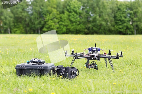 Image of UAV Helicopter With Toolbox And Bag