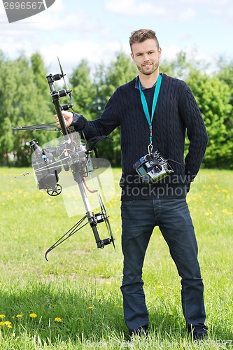 Image of Technician Standing With UAV