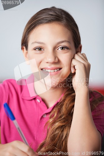 Image of Teenage Schoolgirl In Classroom