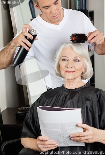Image of Hairstylist Setting Up Client's Hair At Salon