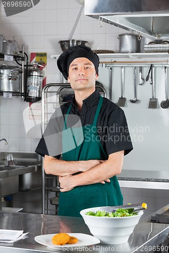 Image of Chef With Salad And Cookie On Counter