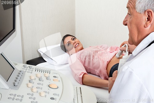 Image of Female Going Through Abdomen Ultrasound