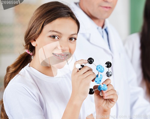 Image of Teenage Girl Holding Molecular Structure