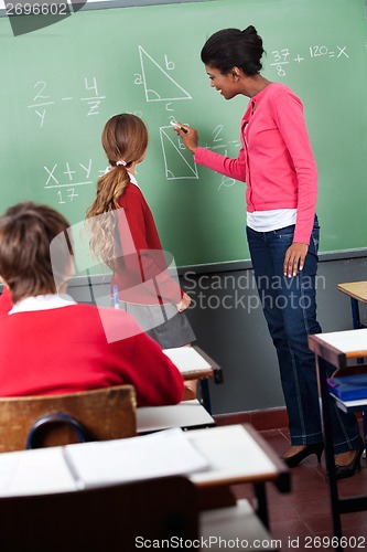 Image of Female Teacher Teaching Mathematics To Students