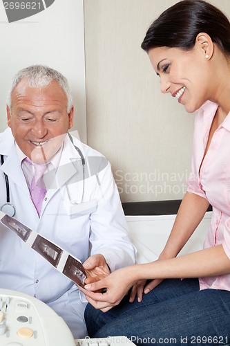 Image of Radiologist Showing Ultrasound Print To Patient