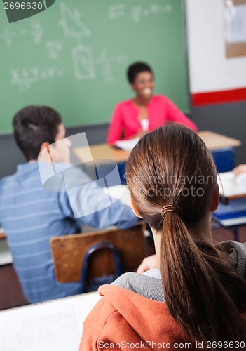 Image of Teenage Schoolgirl With Classmate And Teacher