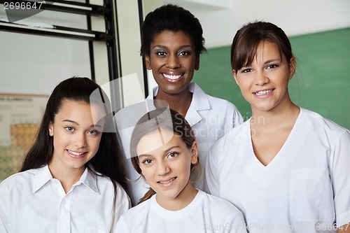 Image of Teacher And Female Students In Science Lab