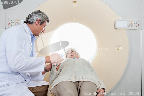 Image of Radiologist Comforting Patient Before CT Scan