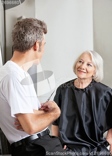 Image of Woman Having Conversation With Hairdresser