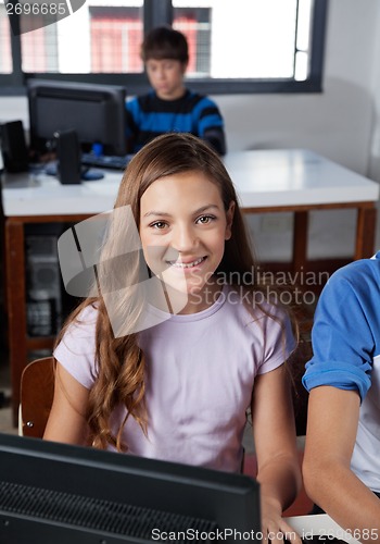 Image of Teenage Schoolgirl Sitting In Computer Lab