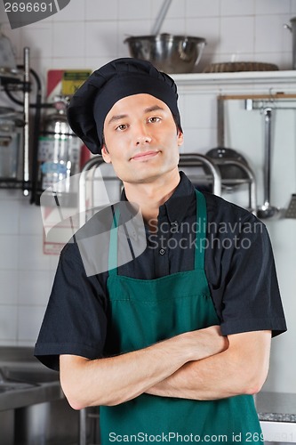 Image of Male Chef With Arms Crossed In Kitchen