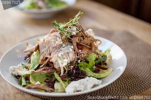 Image of Garnished Chicken Salad At Table