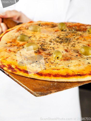 Image of Closeup Of Pizza On Shovel