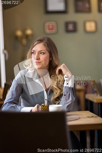 Image of Woman Looking Away At Cafe