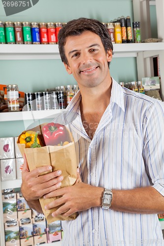 Image of Man With Grocery Bag In Supermarket