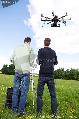Image of Photographer and Pilot Operate UAV