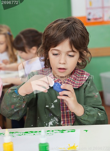 Image of Little Boy Looking At Watercolor