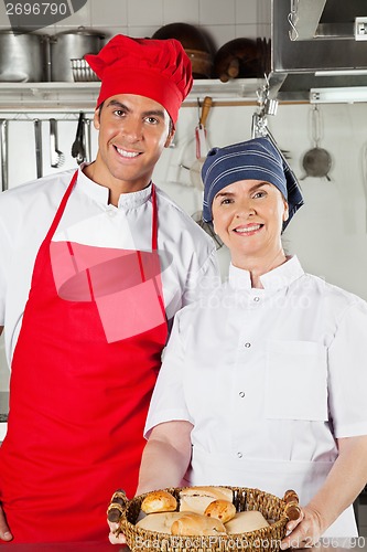 Image of Chefs Holding Basket Full Of Breads