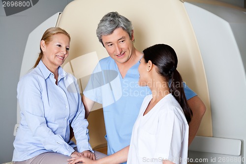 Image of Technicians With Mature Female Patient