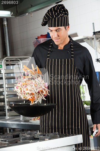 Image of Chef Tossing Stir Fry in Wok