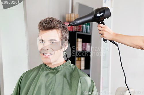 Image of Client Gets His Hair Dried In Salon