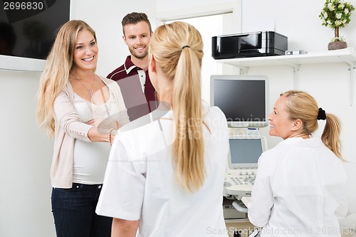 Image of Expectant Couple Visiting Doctor