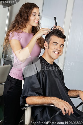 Image of Mature Client Getting Haircut In Salon