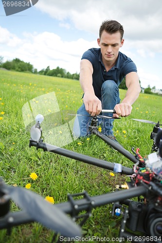 Image of Technician Fixing Propeller Of Surveillance Drone