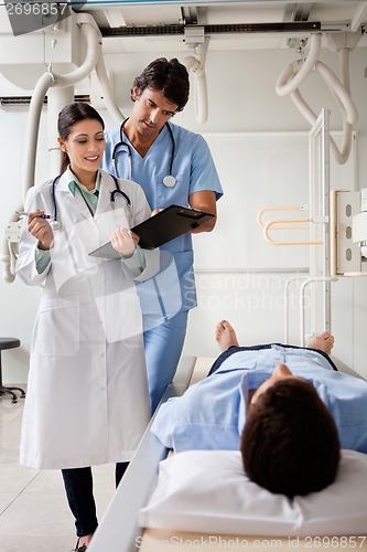 Image of Medical Professionals Communicating With Patient