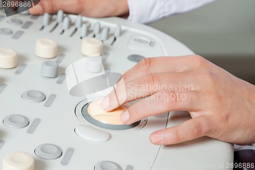 Image of Female Radiologist Operating Ultrasound Machine