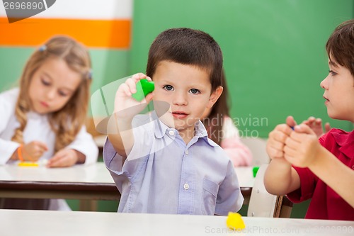 Image of Boy Showing Clay At Classroom
