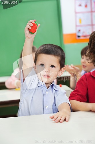Image of Boy Showing Clay Model In Preschool