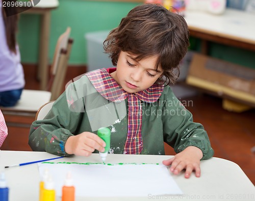 Image of Little Boy Drawing In Art Class