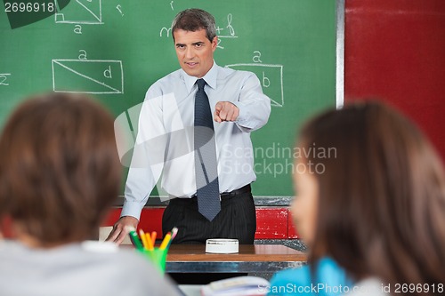 Image of Angry Male Teacher Pointing At Students