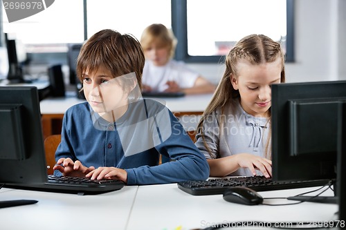 Image of Schoolchildren Using Desktop Pc In Computer Lab