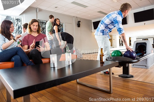 Image of Friends Having Leisure Time in Bowling Club