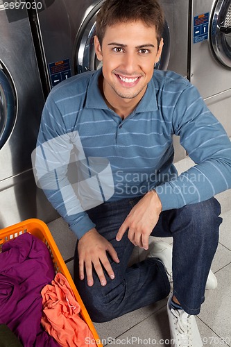 Image of Man With Basket Of Clothes At Laundry