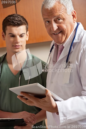 Image of Senior Doctor Holding Clipboard