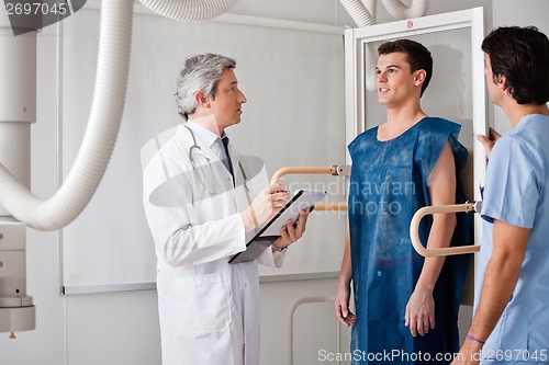 Image of Radiologists Conducting X-ray On Male Patient