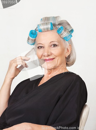 Image of Senior Woman With Hair Curlers