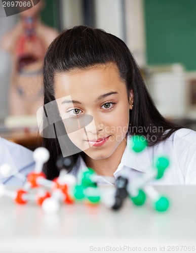 Image of Beautiful Teenage Schoolgirl Looking At Molecular Structure