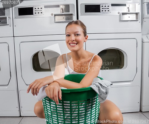 Image of Beautiful Woman With Clothes Basket