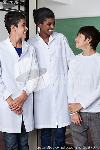 Image of Teacher And Teenage Boys Standing Together