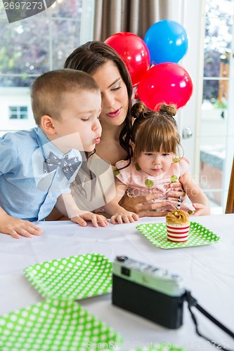 Image of Family Celebrating Boy's Birthday