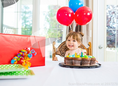 Image of Birthday Girl With Cake And Present On Table