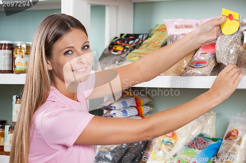 Image of Woman Buying Grocery At Supermarket