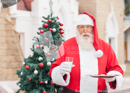 Image of Santa Claus With Milk And Cookies